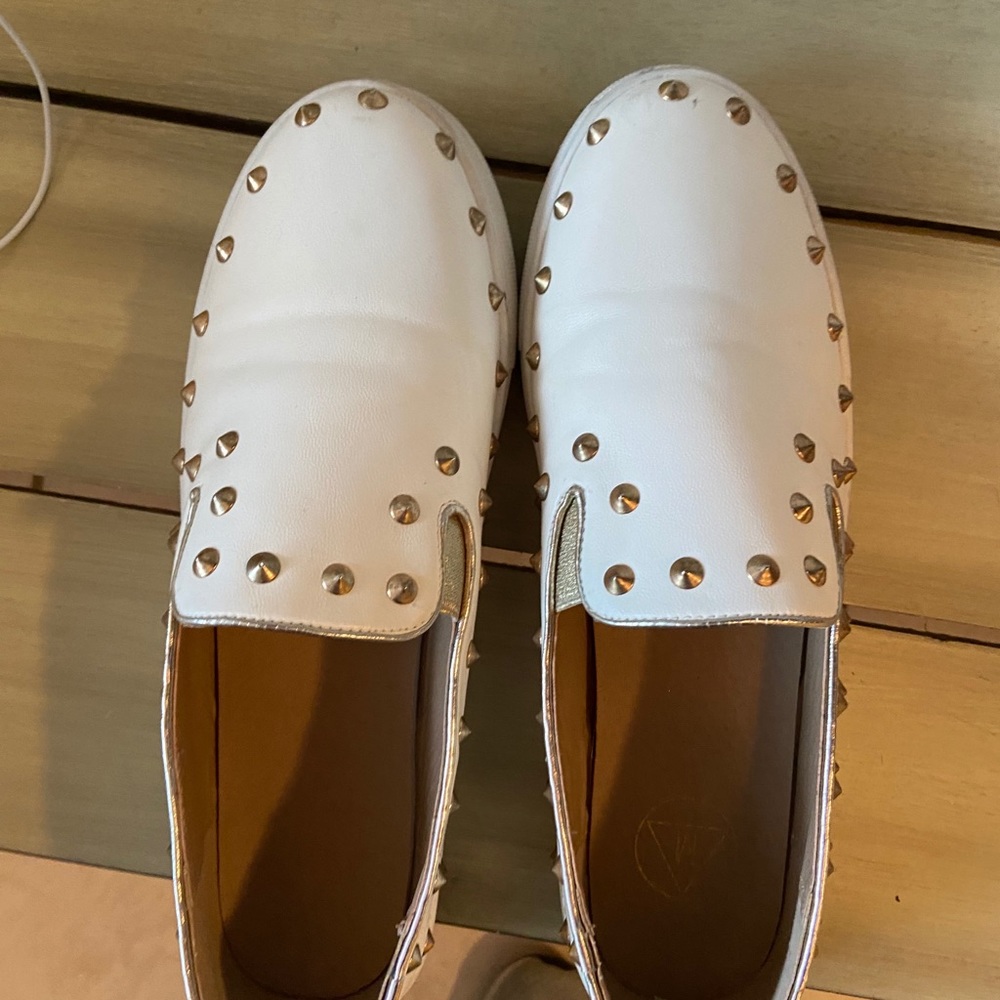 white slip on shoes with gold studs